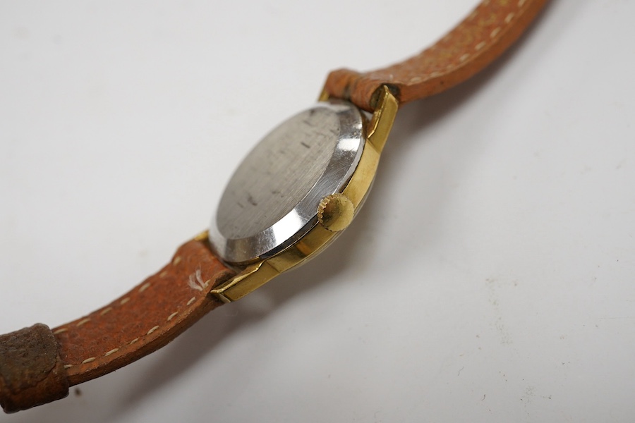 A lady's steel and gold plated Omega manual wind wrist watch, on an associated leather strap, together with a lady rolled gold Bucherer wrist watch. Condition - poor